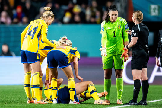Magdalena Eriksson of Sweden in pain and goalkeeper Zecira