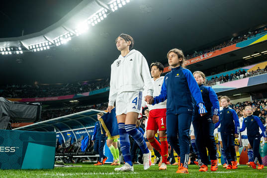 Saki Kumagai and goalkeeper Ayaka Yamashita of Japan