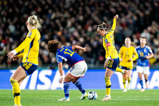 Hana Takahashi of Japan and Kosovare Asllani of Sweden