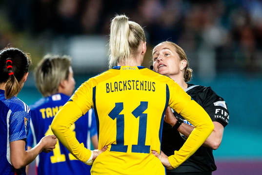 Stina Blackstenius of Sweden in discussion with referee