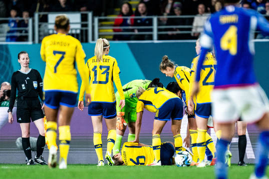 Magdalena Eriksson of Sweden in pain and Amanda Ilestedt,