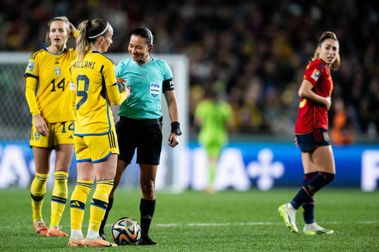Kosovare Asllani of Sweden and referee Edina Alves