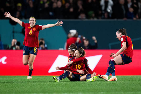 Olga Carmona of Spain celebrates with team mates