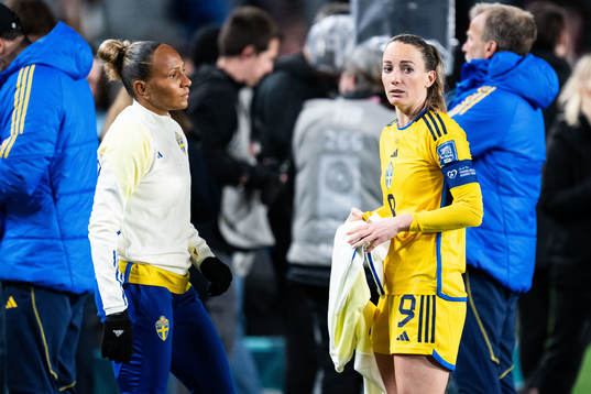 Madelen Janogy and Kosovare Asllani of Sweden look dejected