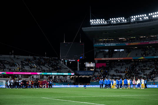 Players of Spain and of Sweden gather