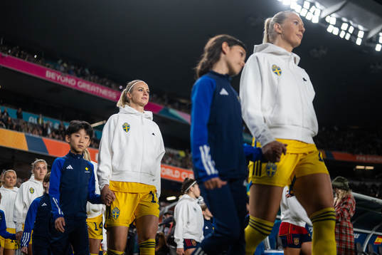 Amanda Ilestedt and Stina Blackstenius of Sweden enter the