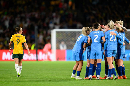 Caitlin Foord of Australia looks dejected as the players of