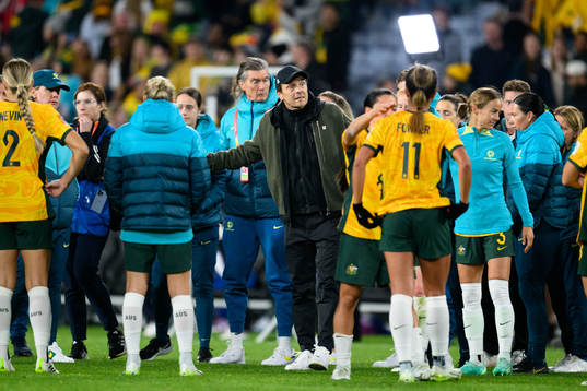 Head coach Tony Gustavsson of Australia talks to the players