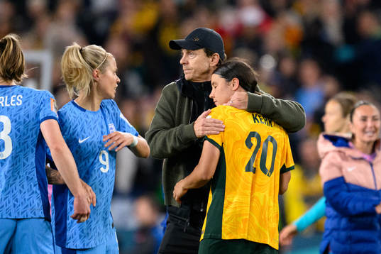 Head coach Tony Gustavsson of Australia hugs Sam Kerr