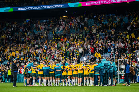 Players and staff of Australia gather