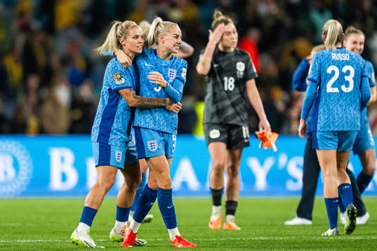 Rachel Daly and Alex Greenwood of England celebrate