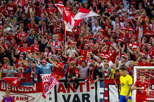 Spectators in the stands celebrates at the final whistle