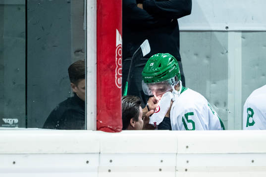 Simon Ryfors of Rögle receives medical attention