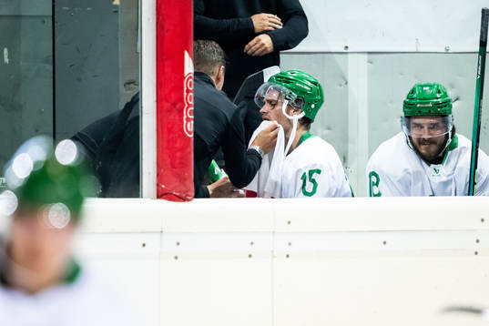 Simon Ryfors of Rögle receives medical attention