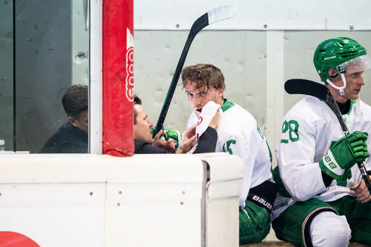 Simon Ryfors of Rögle receives medical attention