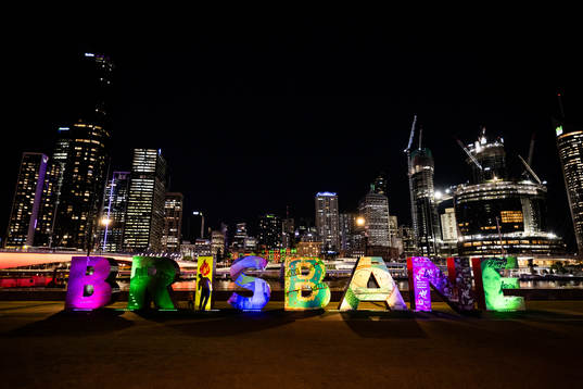 Lit up letters that read ”Brisbane”  is seen in front