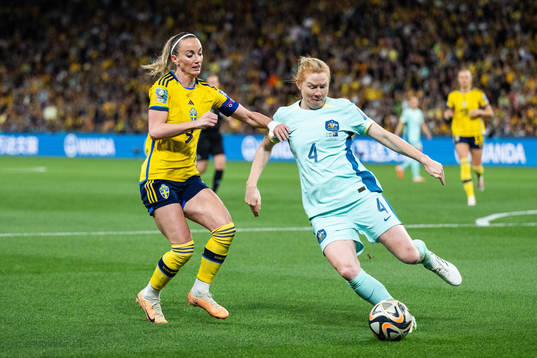 Kosovare Asllani of Sweden and Clare Polkinghorne of