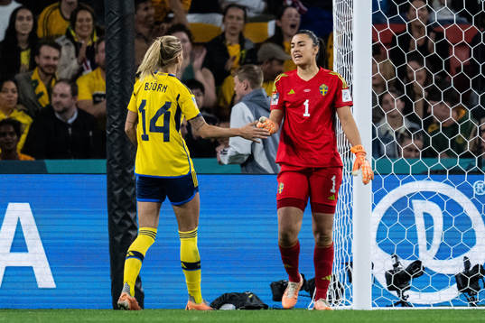 Nathalie Björn and goalkeeper Zecira Musovic of Sweden