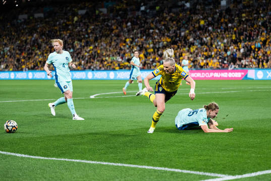 Stina Blackstenius of Sweden and Clare Hunt of Australia