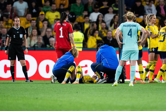Kosovare Asllani of Sweden receives medical attention