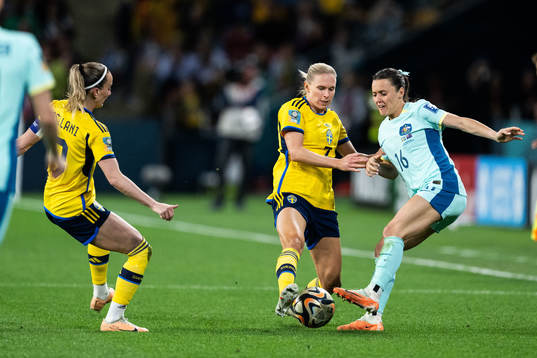 Hayley Raso of Australia against Kosovare Asllani and Jonna