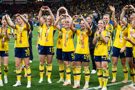 Players of Sweden celebrate with their bronze medals