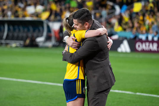 Kosovare Asllani of Sweden celebrates with TV-expert Bojan
