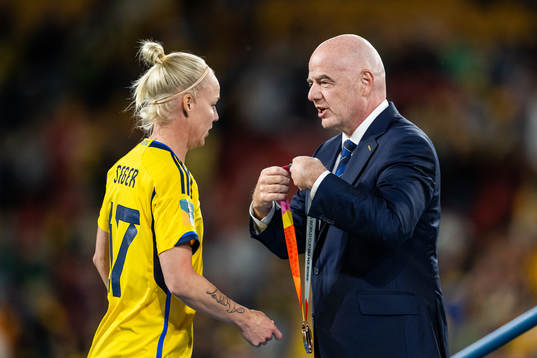 Caroline Seger of Sweden receives her medal from FIFA