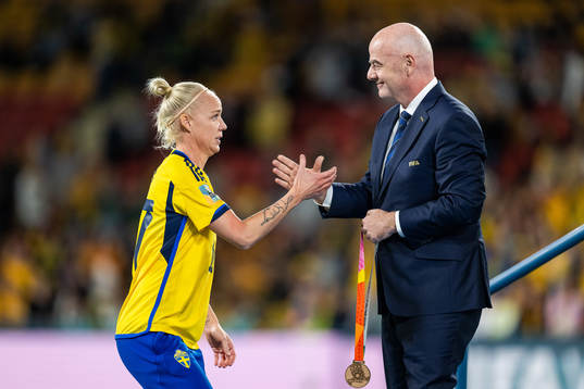 Caroline Seger of Sweden receives her medal from FIFA