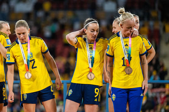 Kosovare Asllani and Caroline Seger of Sweden  with their