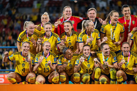 Players of Sweden celebrate with their medals