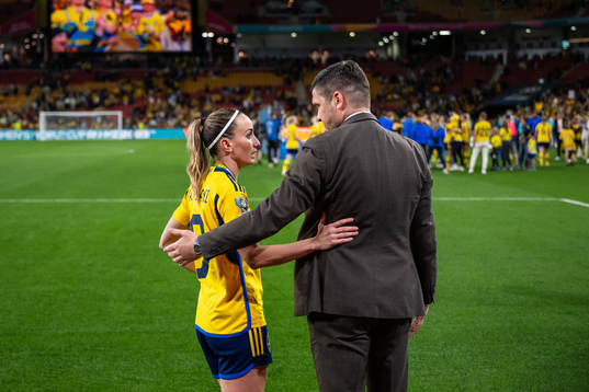 Kosovare Asllani of Sweden talks to Bojan Djordjic, of