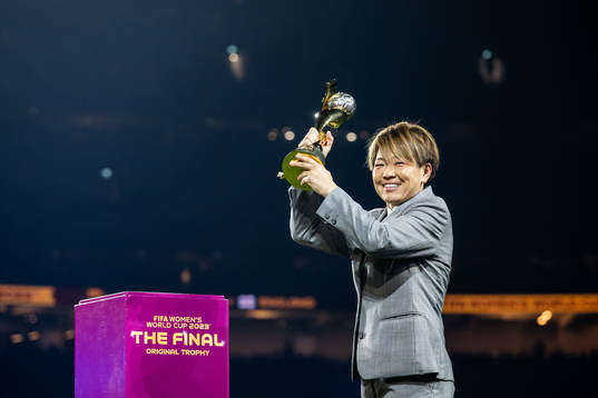 Aya Miyama with the World Cup trophy