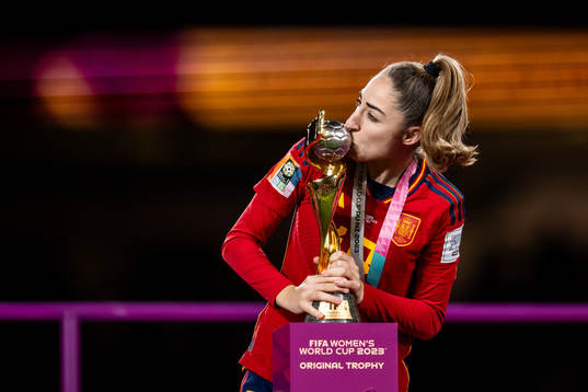 Olga Carmona of Spain celebrates with the trophy