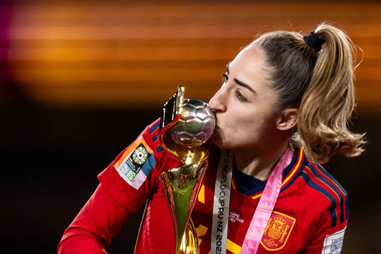 Olga Carmona of Spain celebrates with the trophy