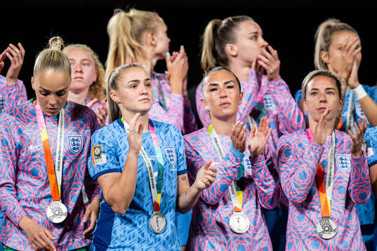 Players of England with their silver medals