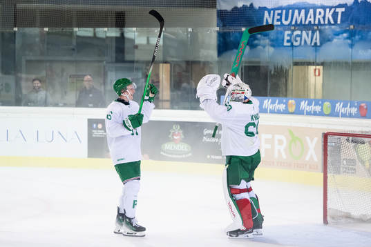 Adam Engström and goalkeeper Petr Kvaca of Rögle celebrate