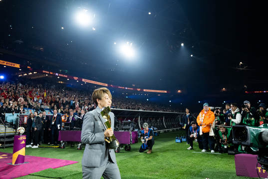 Aya Miyama and the World Cup trophy