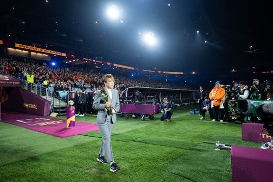 Aya Miyama and the World Cup trophy