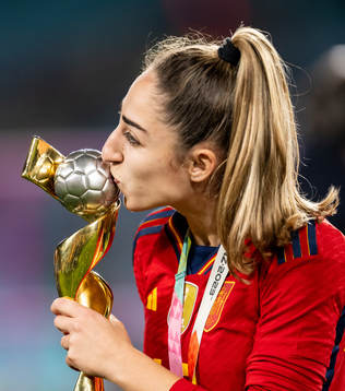 Olga Carmona of Spain celebrates with the trophy