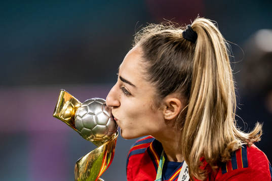 Olga Carmona of Spain celebrates with the trophy