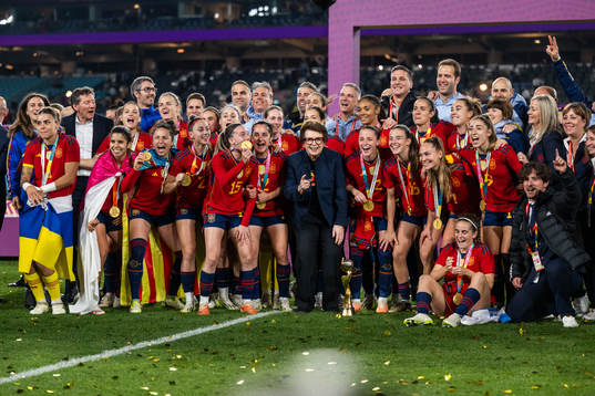 Players of Spain celebrate with their medals as they pose
