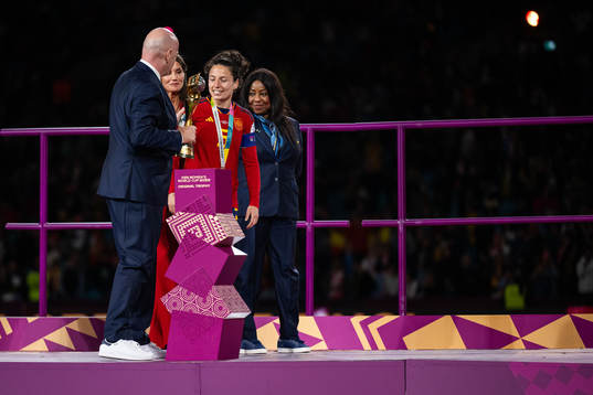 FIFA president Gianni Infantino hands the trophy to Ivana