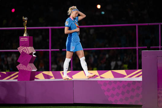 Chloe Kelly of England looks dejected as she walks by the