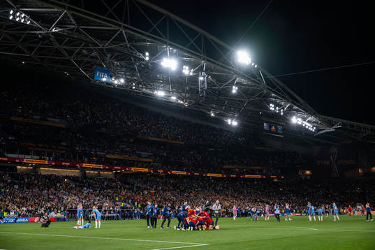 Players of England look dejected while players of Spain