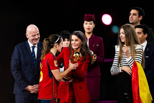 Queen Letizia and Princess Sofia of Spain hand out the