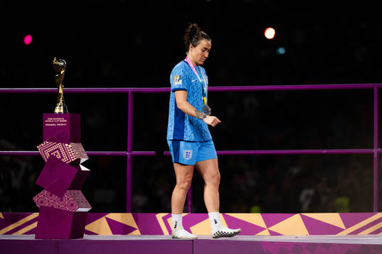 Lucy Bronze of England looks dejected as she walks past the