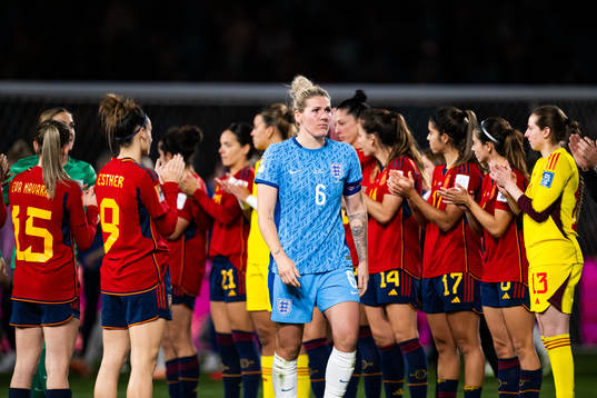 Millie Bright of England looks dejected as she walks past