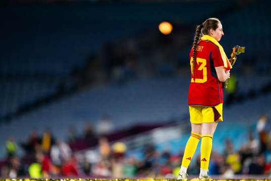 Goalkeeper Enith Salon of Spain celebrates with the trophy