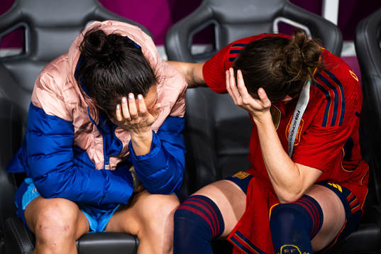 Lucy Bronze of England looks dejected and is consoled by